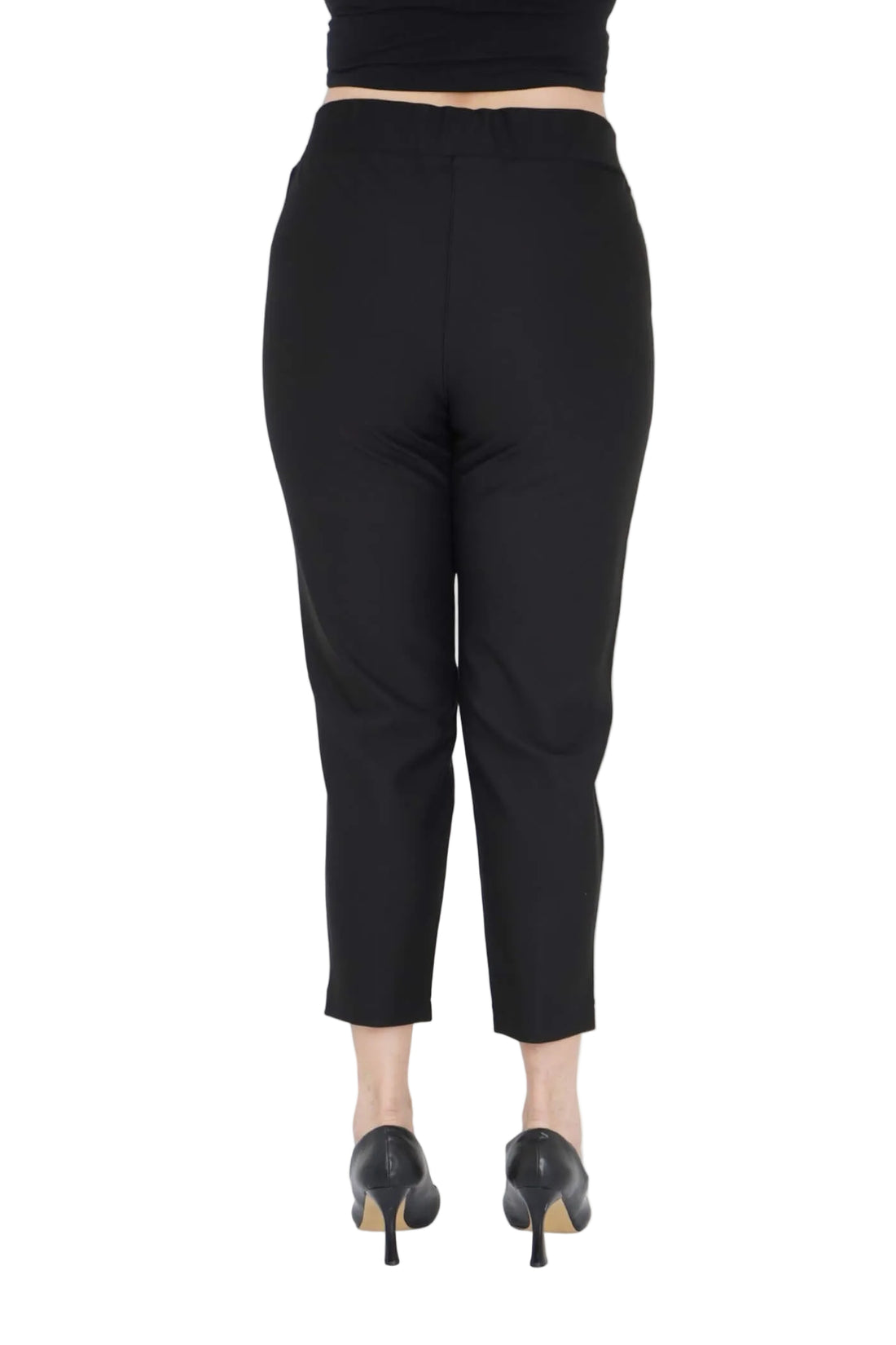 Black pants worn by a model on a white background .