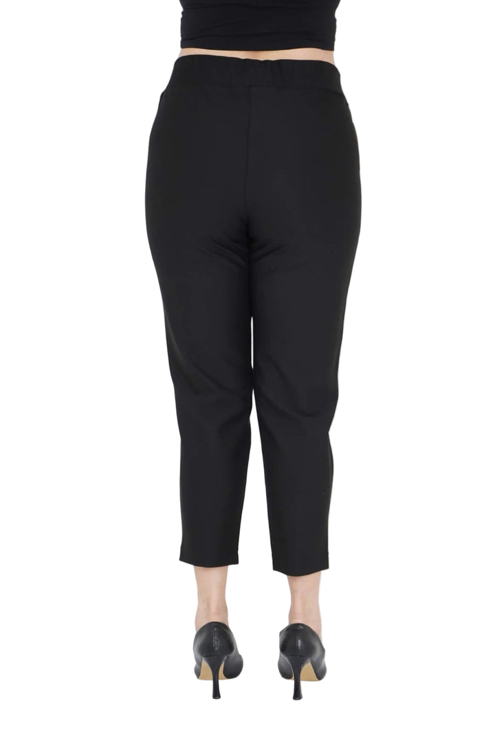 Black pants worn by a model on a white background .